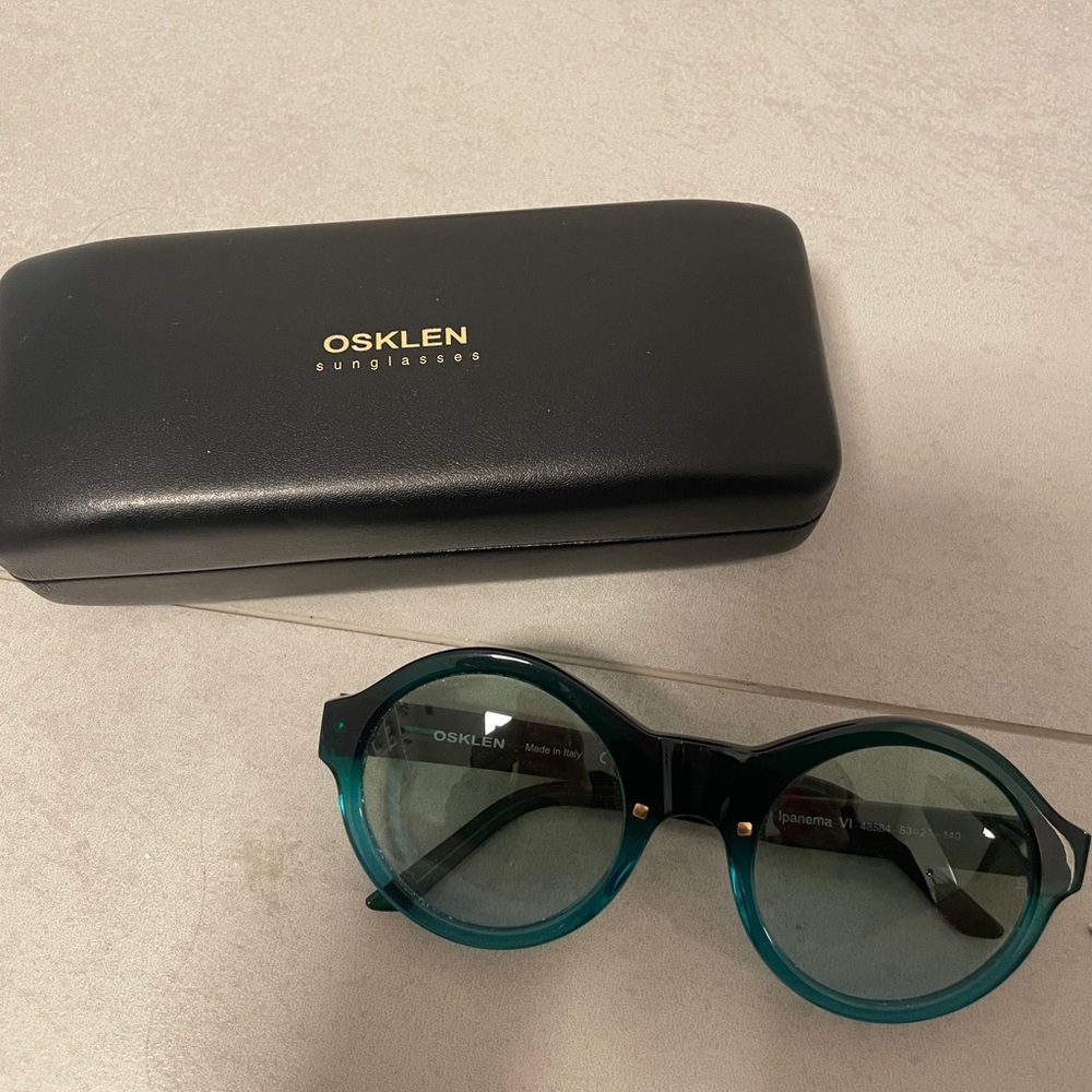 lightly used dark green osklen sunglasses
